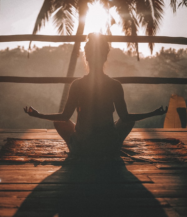 Meditation silhouette by lake